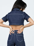 Cropped jacket Dark wash denim Short sleeves Classic collar Buttons fastening at front Twin chest pockets