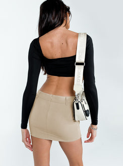back view of model wearing Princess Polly Motel Wahip Mini Skirt In Soft Tailoring Beige Mini Skirts 
