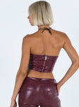 Bustier Faux leather material Inner silicone strip at bust Wired cups Zip fastening at back Pleats at side Pointed hem