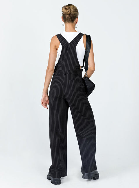 Overalls Oversized fit Pinstripe print  Adjustable shoulder straps  Single chest pockets  Belt looped waist  Four classic pockets  Invisible zip fastening at side  Wide leg 