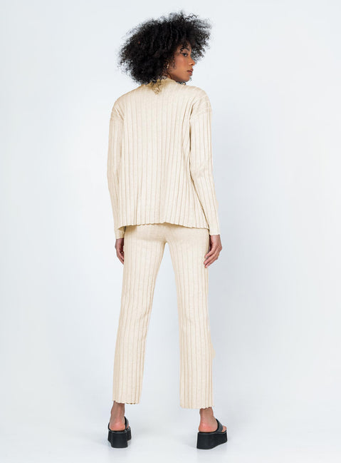 Matching set  Relaxed fit Princess Polly Exclusive 63% recycled polyester 25% polyester 12% nylon Heavy wide ribbed material  Long sleeve button up top   Twin front pockets  High waisted pants  Elasticated waistband Slim leg  Raw-edge hem 