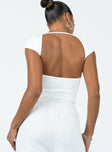 back view of model wearing Princess Polly Solita Bodysuit White Short Sleeves Boat Neck 