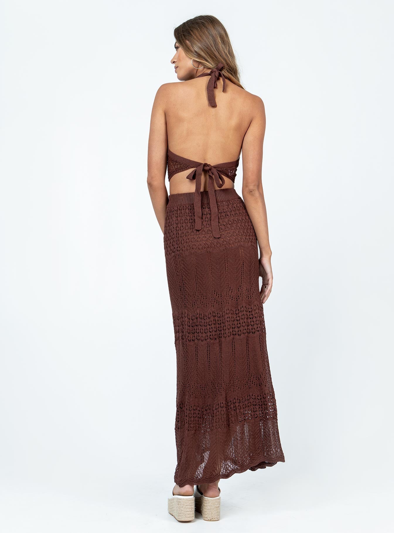 Matching set Crochet material  Halter neck top Exposed back High-waisted maxi skirt  Elasticated waistband 