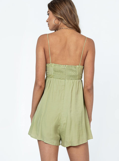 Romper Silky material  Lace trimming  Elasticated shoulders Tie at bust  Shirred back  Invisible zip fastening at back 