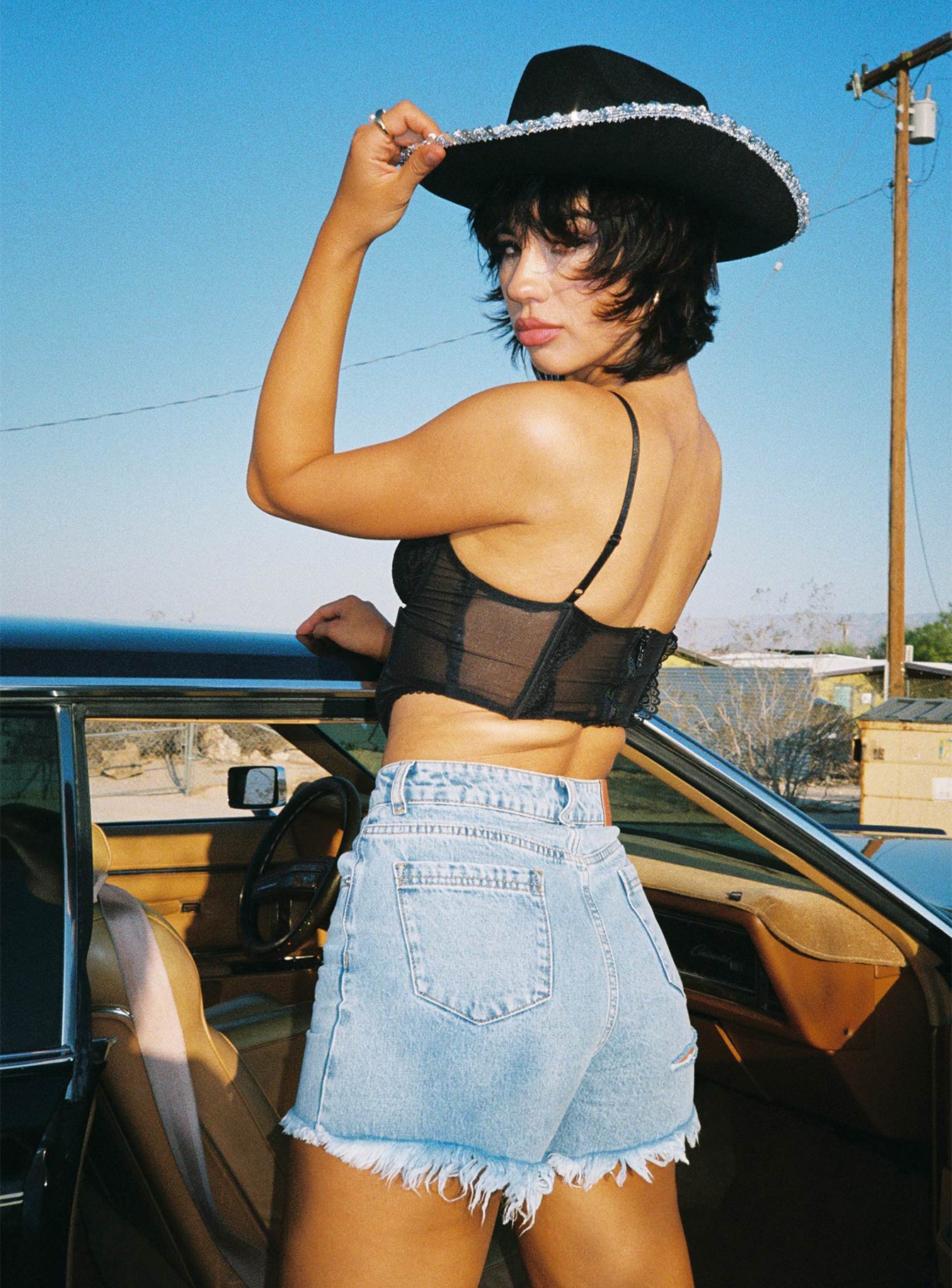 back view of model wearing Princess Polly On Tour Denim Mom Shorts Light Blue High Waisted Shorts 