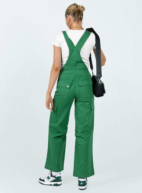 Overalls Cargo style Adjustable shoulder straps  Chest pocket  Button fastening at hips Six leg pockets  Silver-toned hardware  Wide leg  Pleated detail at inner leg