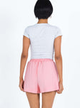 back view of model wearing Princess Polly Mateo Shorts Pink mid-rise 