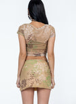 Matching set Sheer mesh material  Floral print  Crop top  V neckline  Cap sleeves  Mini skirt  Elasticated waistband  Side slit 