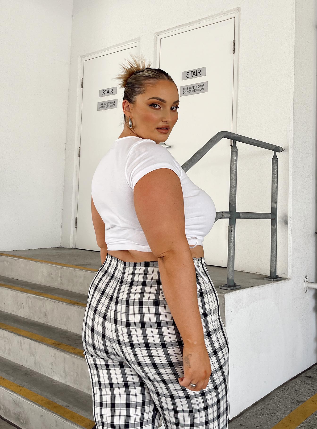 back view of model wearing Princess Polly Evant Tee White Curve 