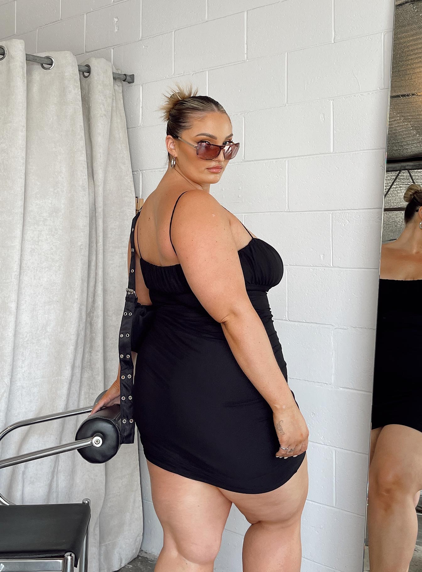 back view of model wearing Princess Polly Penney Mini Dress Black Curve 