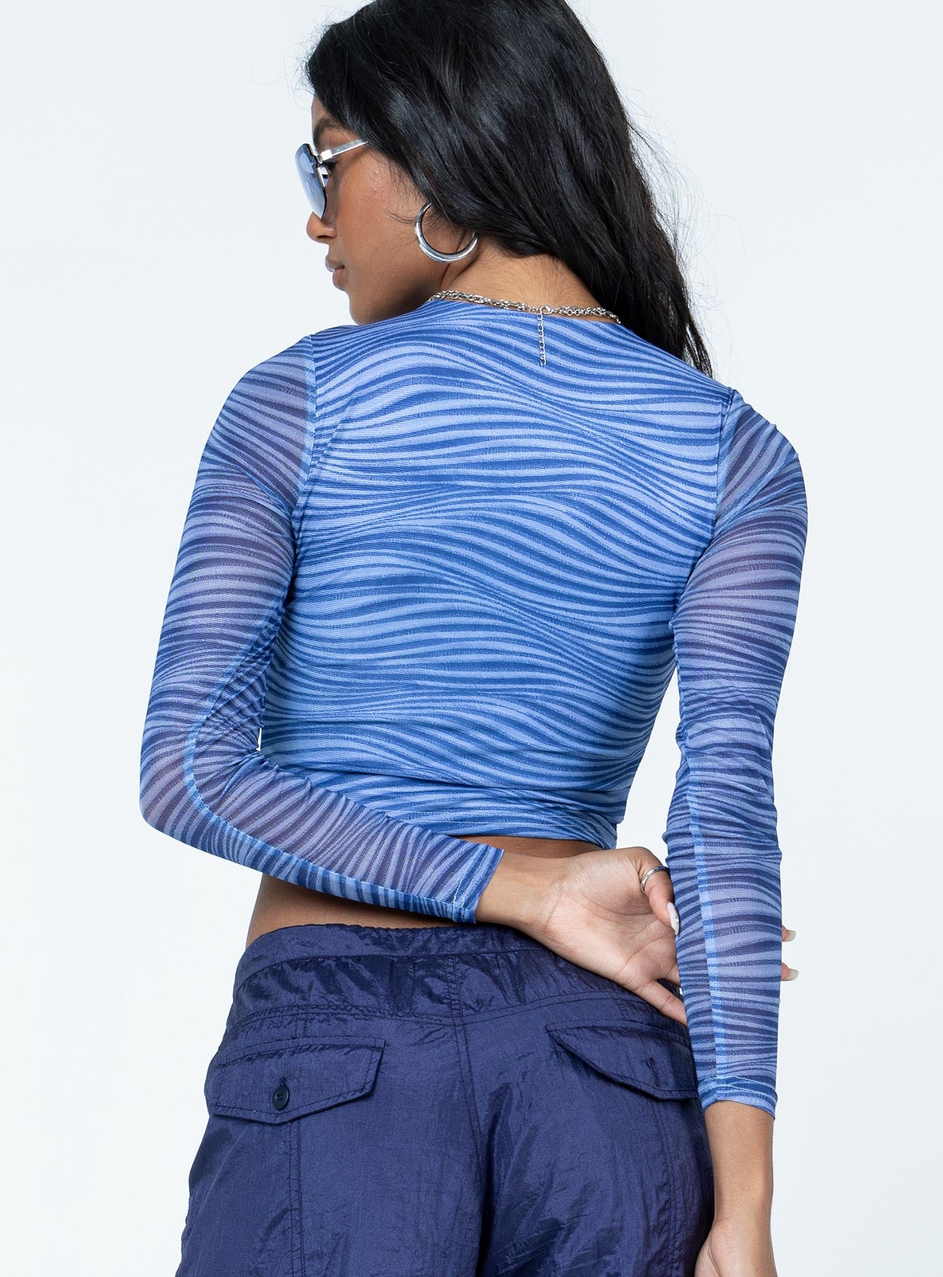 back view of model wearing Princess Polly Knox Top Blue Full Sleeves Crew Neck 