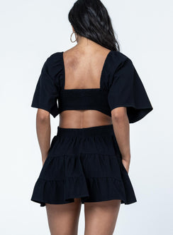 back view of model wearing Princess Polly Dark Star Mini Dress Black Square Neck 