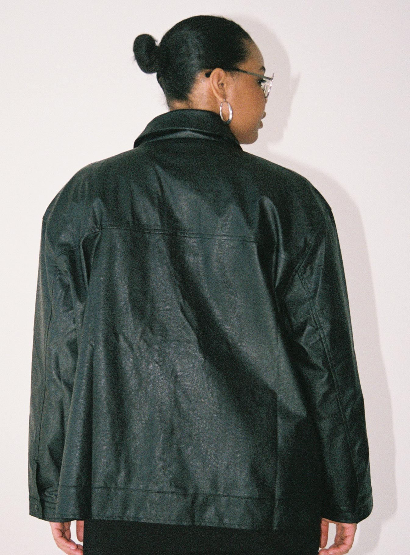 Jacket Faux leather material Zip front fastening Pointed collar Twin chest & hip pockets Single button cuff