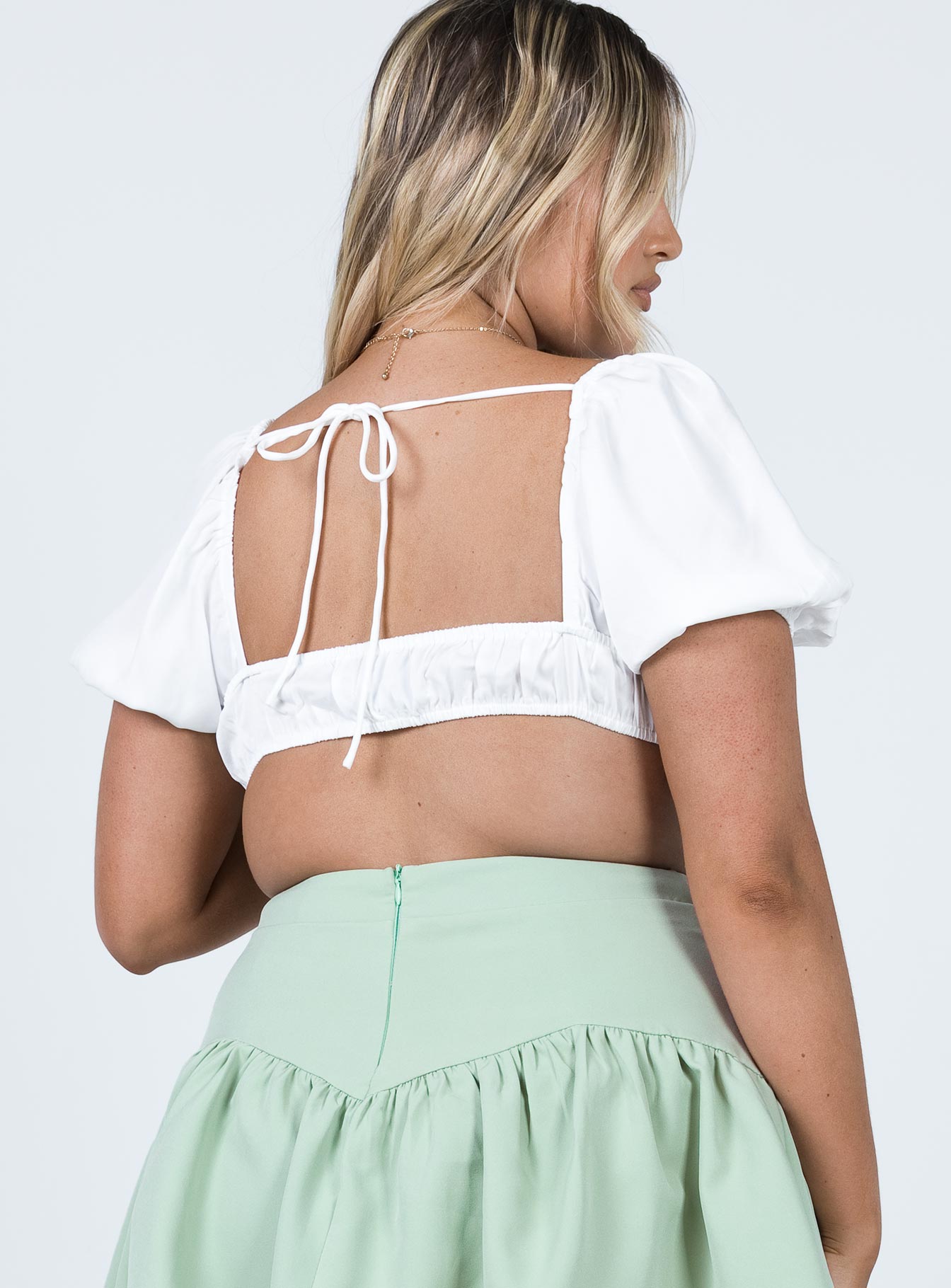 back view of model wearing Princess Polly Whitley Top White Short Sleeves Sweetheart 