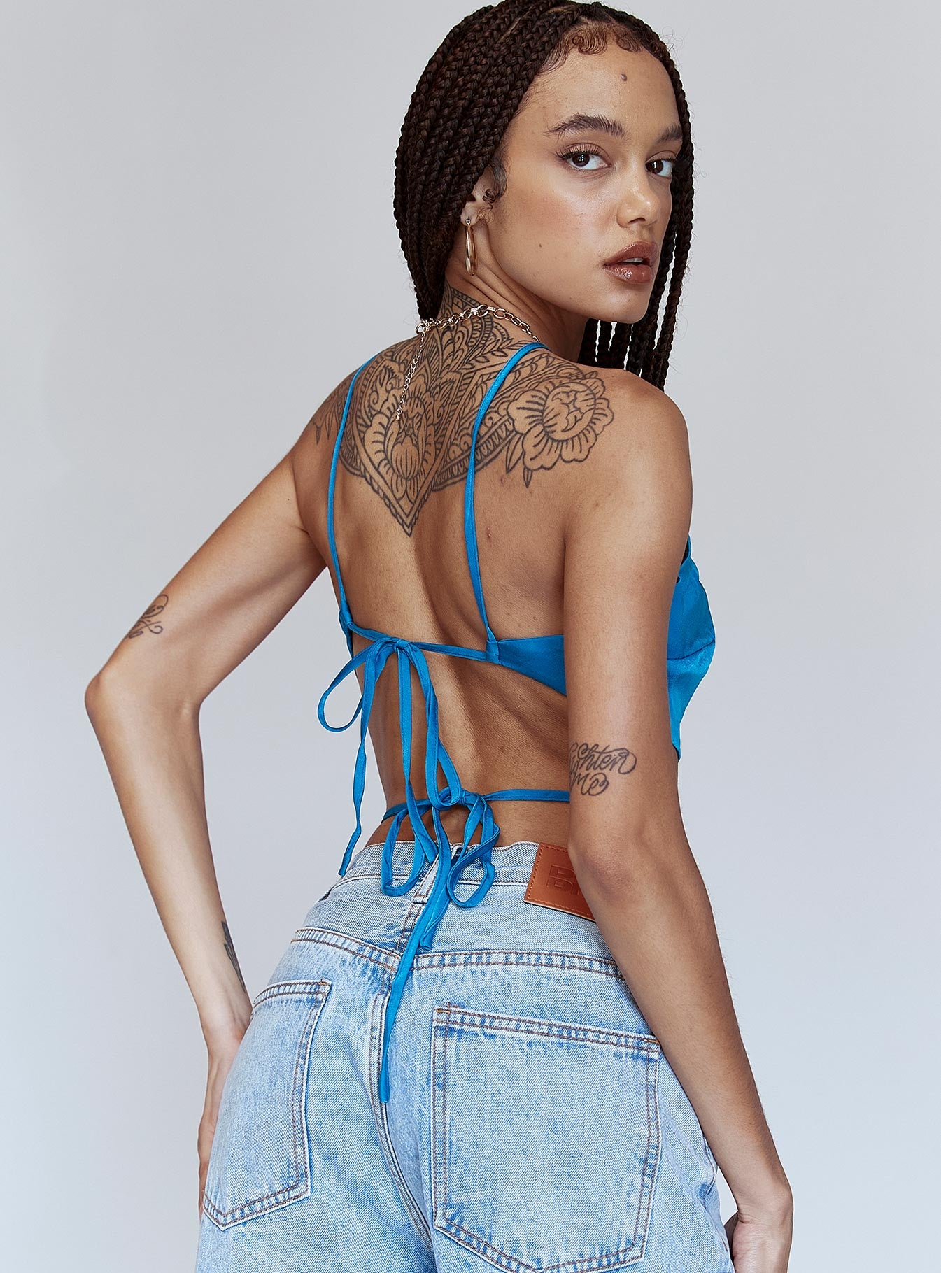 back view of model wearing Princess Polly End Game Top Blue 