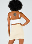 back view of model wearing Princess Polly The Lola Mini Skirt Ecru 