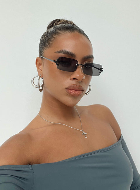 Sunglasses Frameless Black tinted lenses Slim arms Silicone nose pads