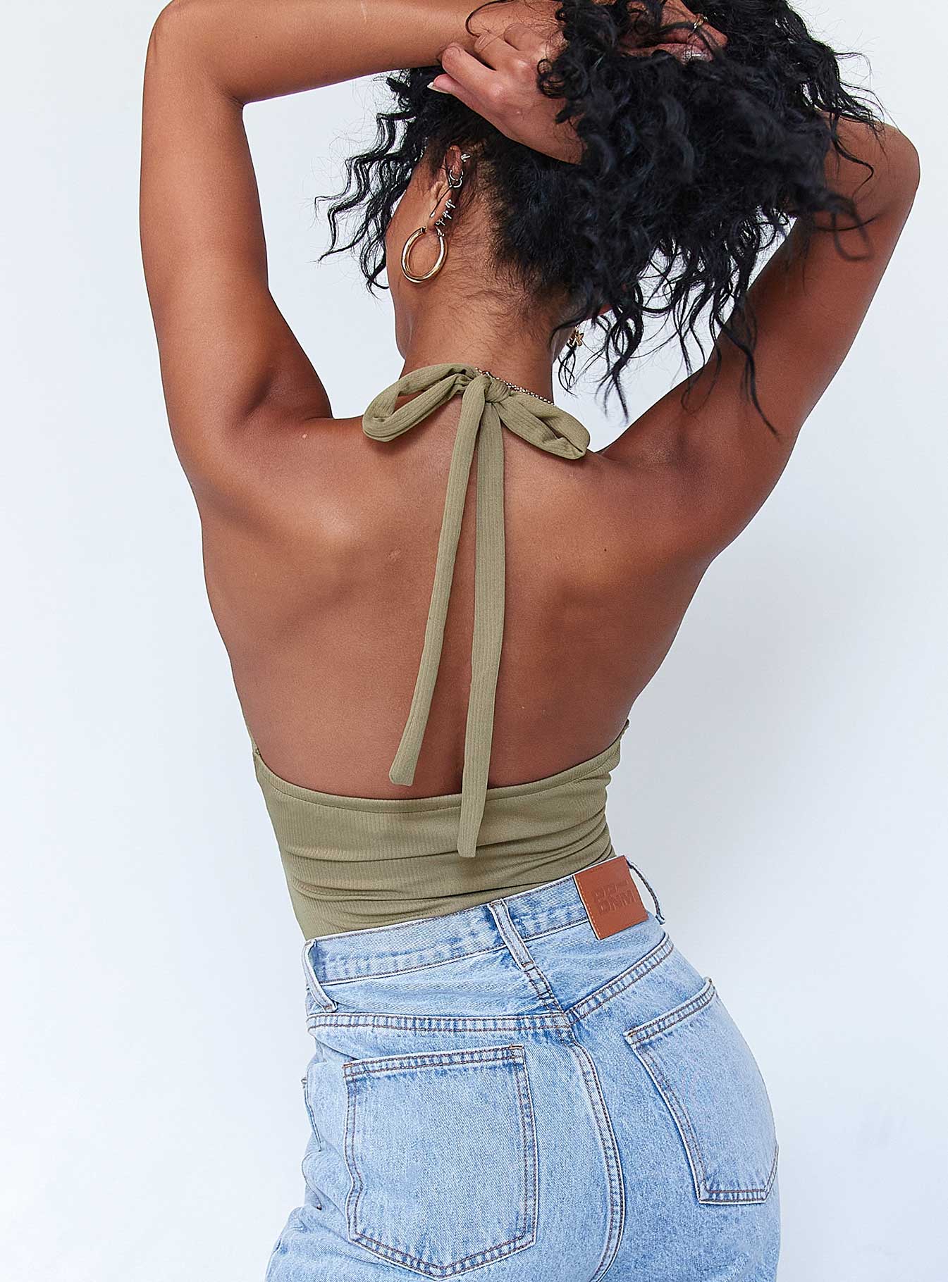 back view of model wearing Princess Polly London Bodysuit Khaki Sleeveless Plunger 