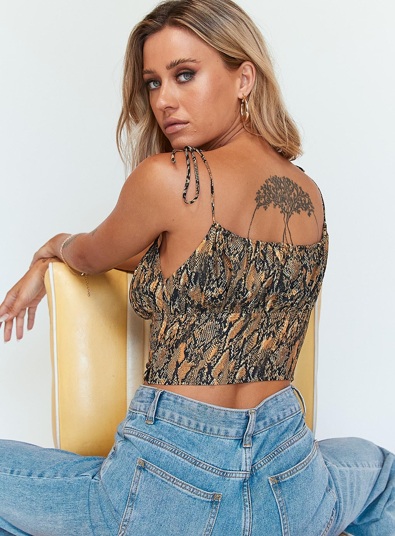 back view of model wearing Princess Polly Duran Top Brown 