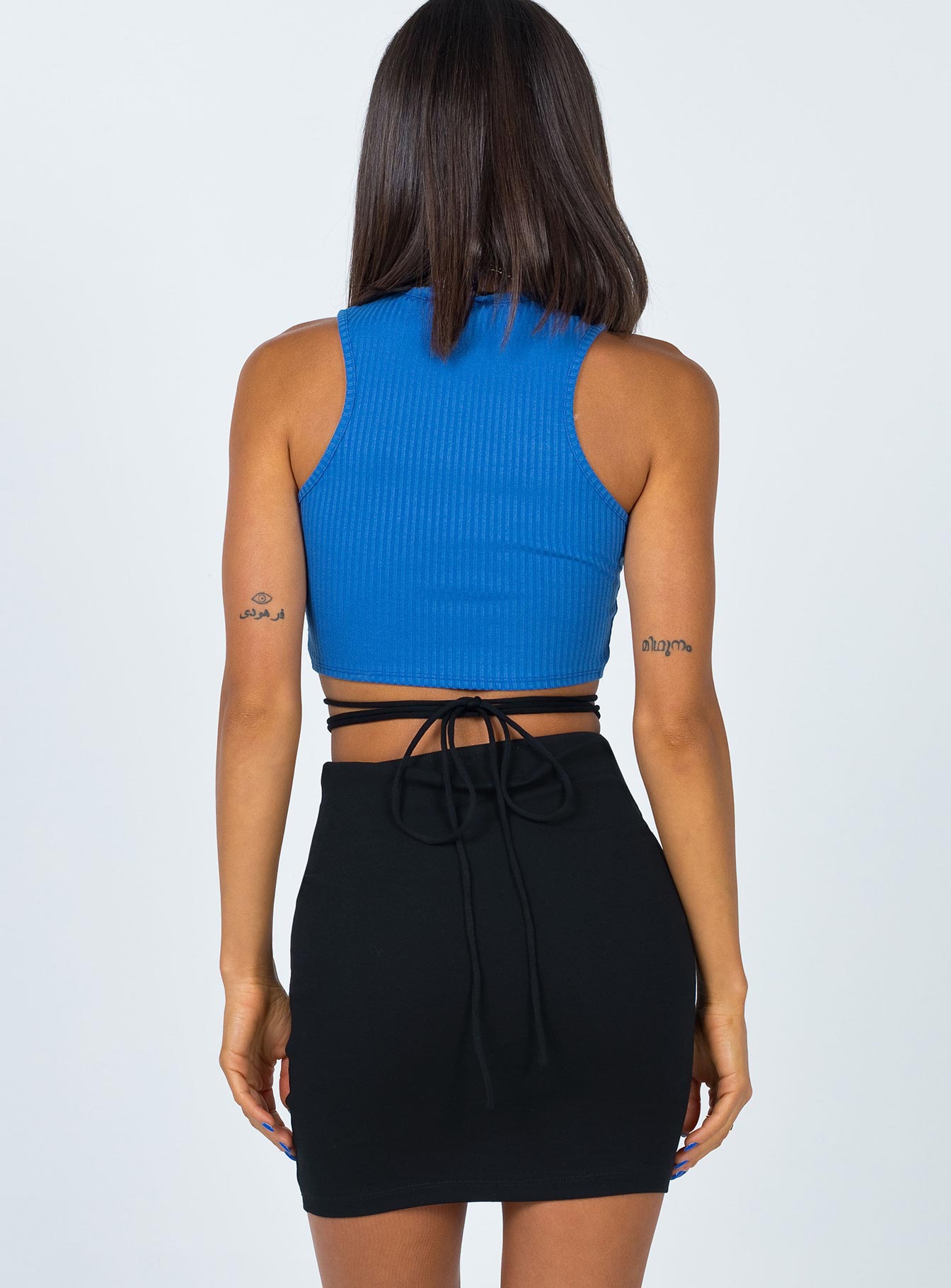 back view of model wearing Princess Polly Dom Mini Skirt Black 