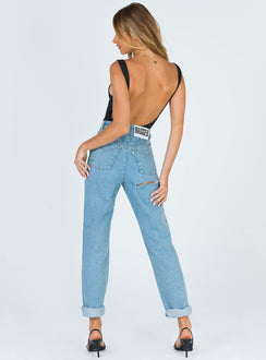 back view of model wearing Princess Polly Ragged Priest Butt Cut Jean Light Blue Mid Rise 