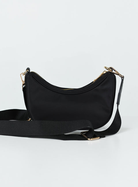 Crossbody bag Zip fastening Gold-toned hardware Two internal pockets Flat base