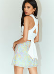 back view of model wearing Princess Polly Retro Swirl Wrap Mini Skirt 