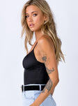 side view of model wearing Princess Polly Levey Bodysuit Black Sleeveless Scoop Neck 