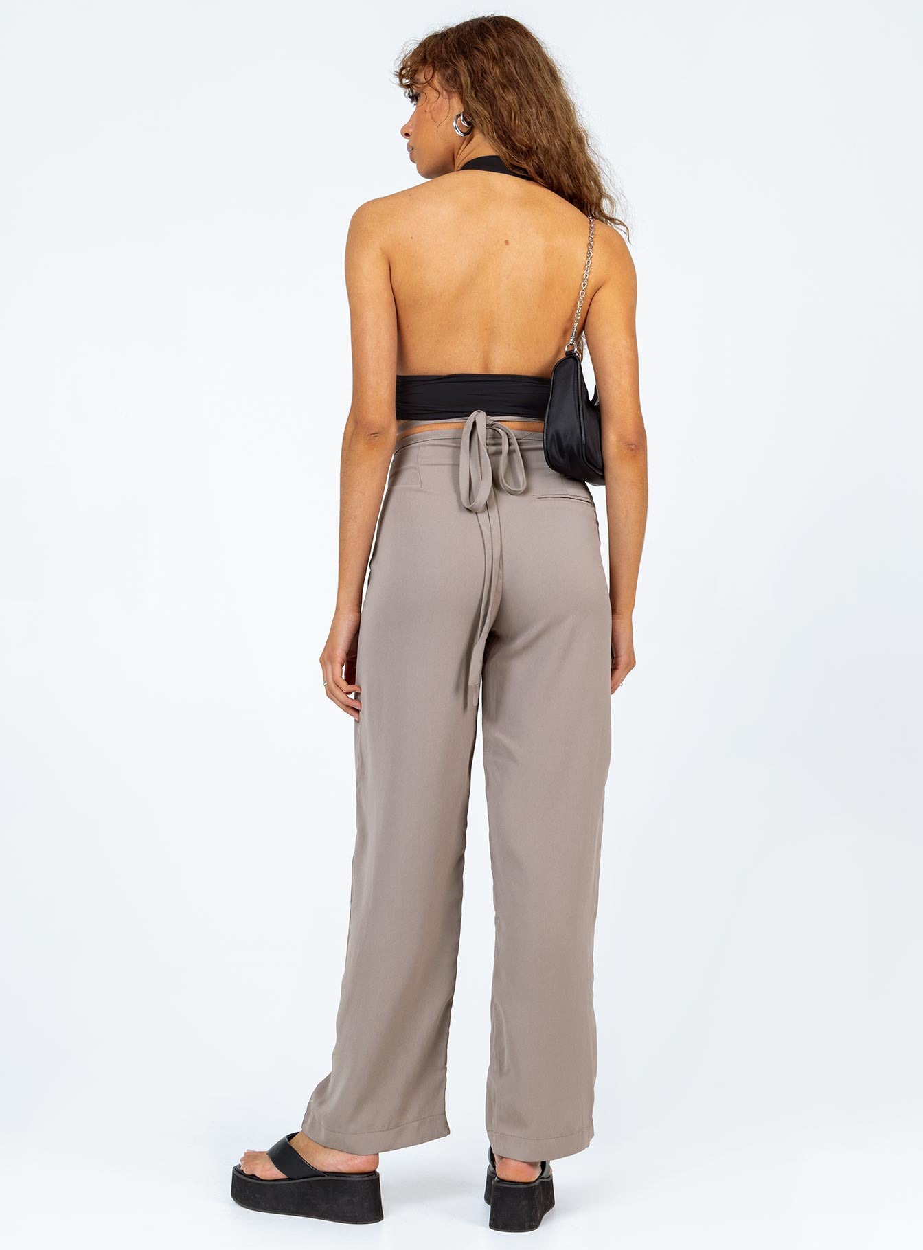 back view of model wearing Princess Polly Rodney Pants Beige 