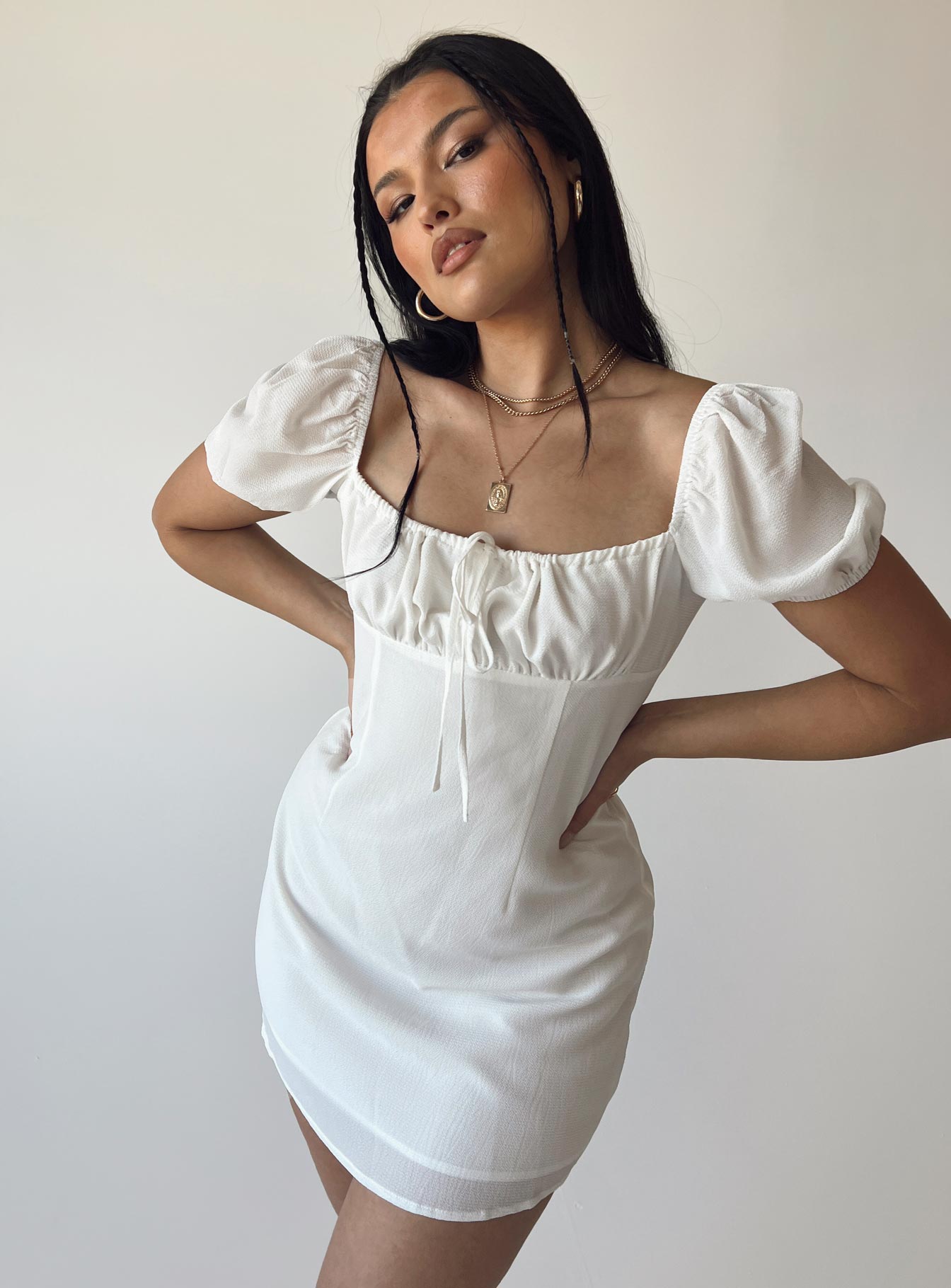 Front view of model wearing  front Princess Polly Square Neck  Snowdrop Mini Dress White