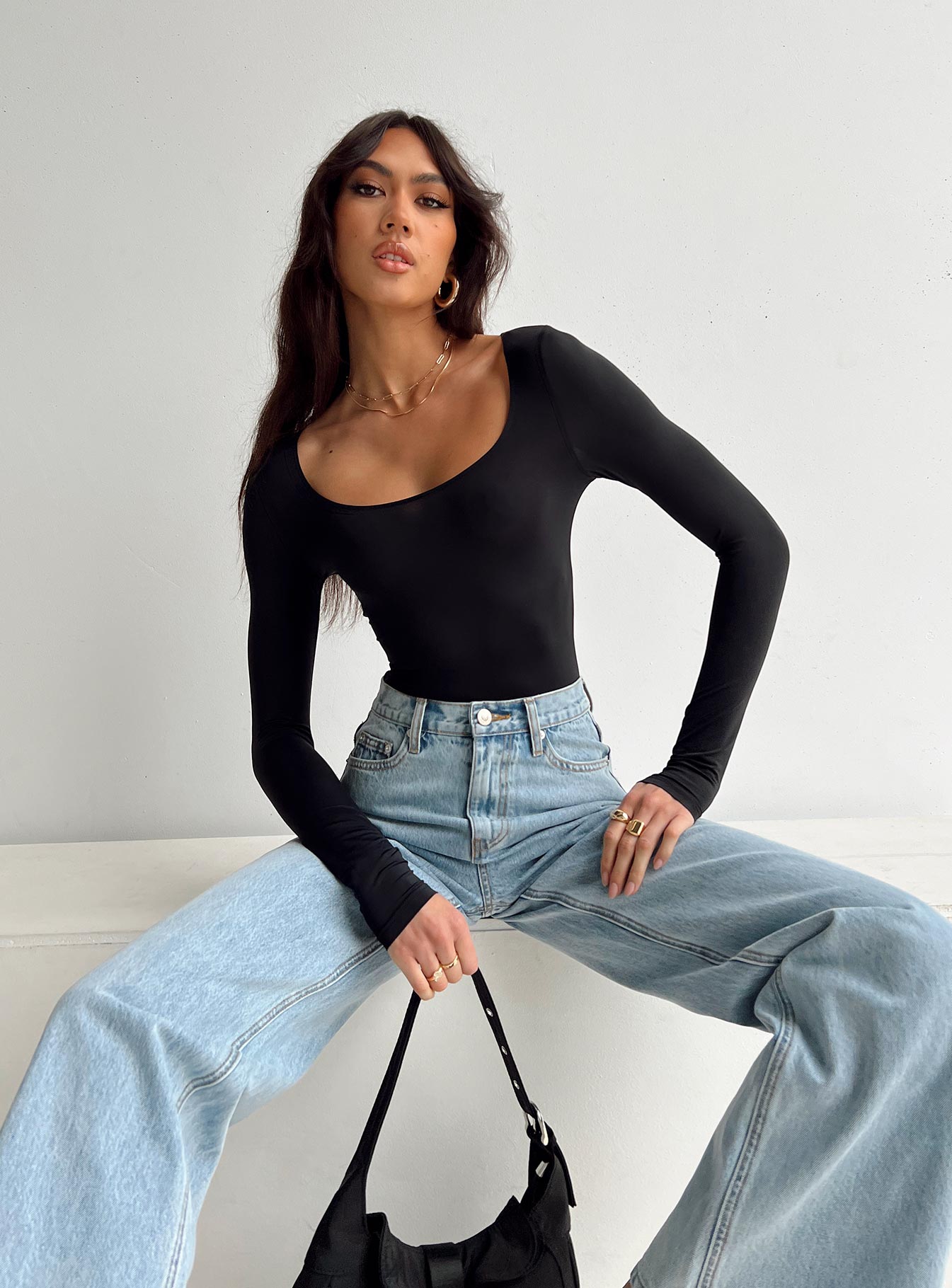 side view of model wearing Princess Polly Malllard Bodysuit Black Full Sleeves Scoop Neck 