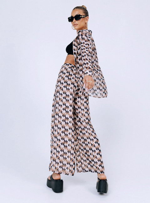 Matching set Sheer material  Geometric print  Button up shirt  High waisted pants  Elasticated drawstring waistband  Wide leg