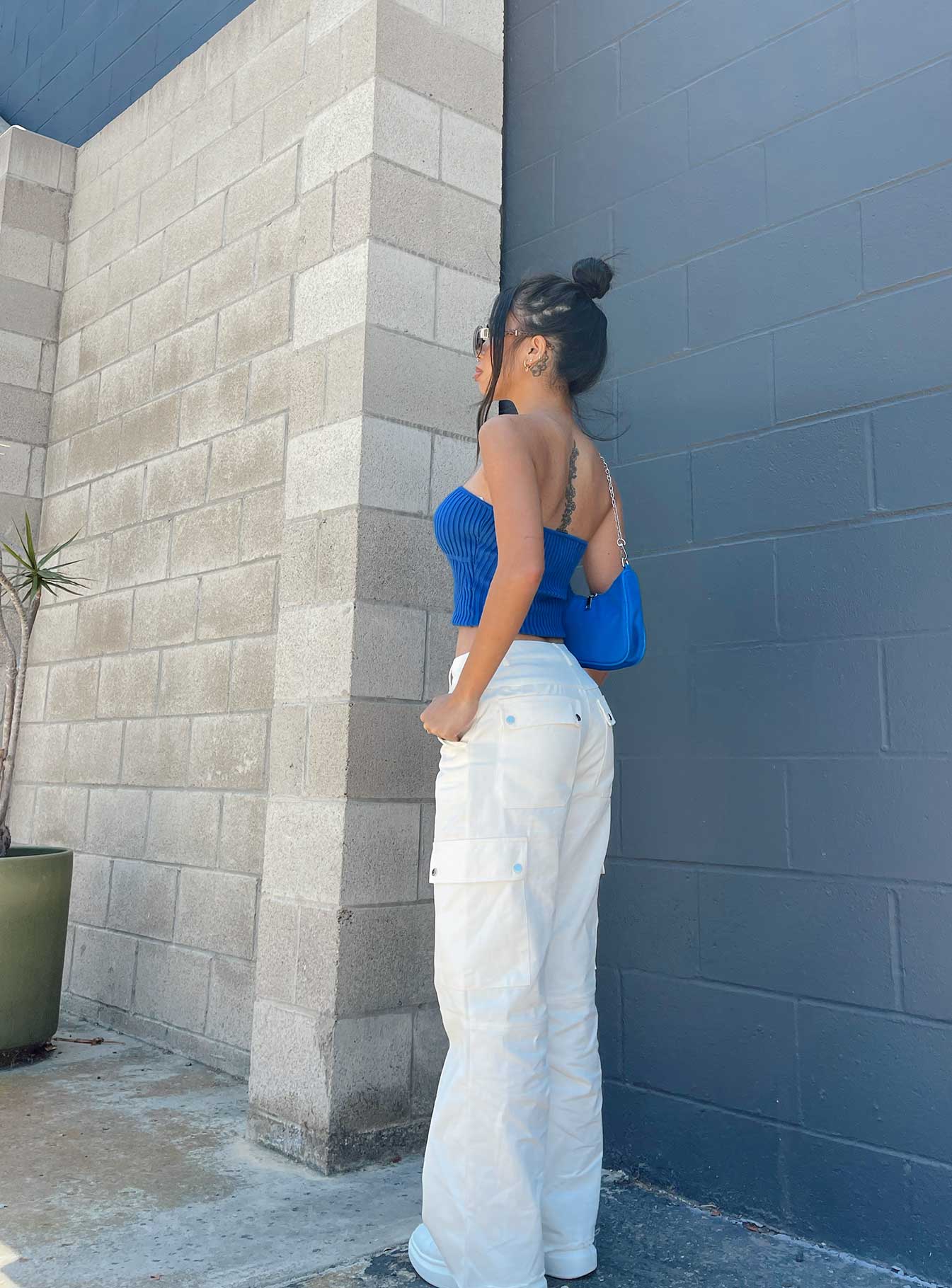 side view of model wearing Princess Polly Royce Strapless Top Blue Sleeveless 