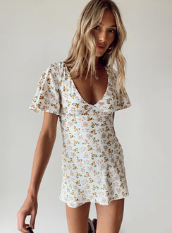 Front view of model wearing  front Princess Polly Crew Neck  Lucine Mini Dress White Floral