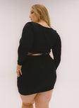 back view of model wearing Princess Polly Nolan Mini Dress Black Curve Square Neck 