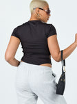 back view of model wearing Princess Polly Riverstone Bodysuit Black Short Sleeves High Neck 