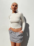 Front view of model wearing  front Princess Polly Sleeveless High Neck  Rixie Long Sleeve Top Beige