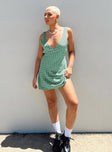 Front view of model wearing  front Princess Polly High Neck  Nellie Mini Dress Green Polka Dot