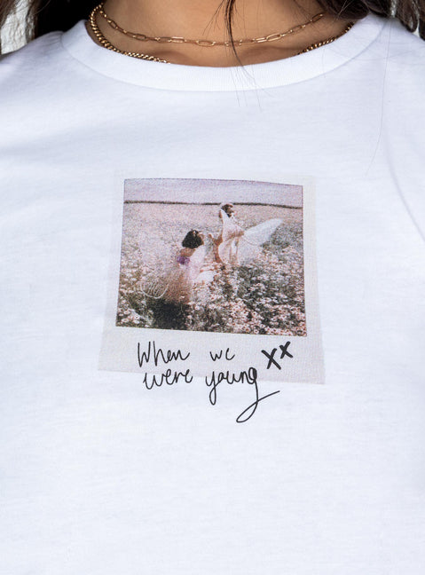 Front view of model wearing  front Princess Polly Full Sleeves Crew Neck  Shake it Graphic Tee White