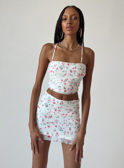 Matching set Mesh material  Floral print  Cowl neckline  Lace-up back tie fastening  High waisted mini skirt  Elasticated waist  Lettuce edge hem 