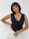 Front view of model wearing  front Princess Polly Sleeveless V-Neck  Silvanna Top Black