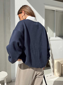 back view of model wearing Princess Polly New York Crewneck Sweatshirt Navy regular 