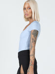 side view of model wearing Princess Polly Chavis Bodysuit Blue Short Sleeves Square Neck 