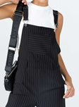 Overalls Oversized fit Pinstripe print  Adjustable shoulder straps  Single chest pockets  Belt looped waist  Four classic pockets  Invisible zip fastening at side  Wide leg 