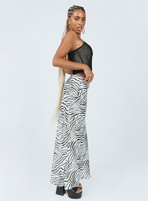   side view of model wearing Princess Polly Ziggy Maxi Skirt Black / White Maxi 