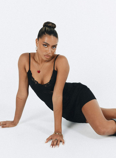 Front view of model wearing  front Princess Polly Asymmetric Neckline  Agnola  Lace Trim Mini Dress Black