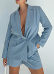 Blue blazer Lapel collar Button fastening at front Shoulder pads Faux hip pockets Split at back