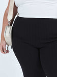 Front view of model wearing  front Princess Polly High Waisted Pants  Allen Ribbed Pants Black Curve