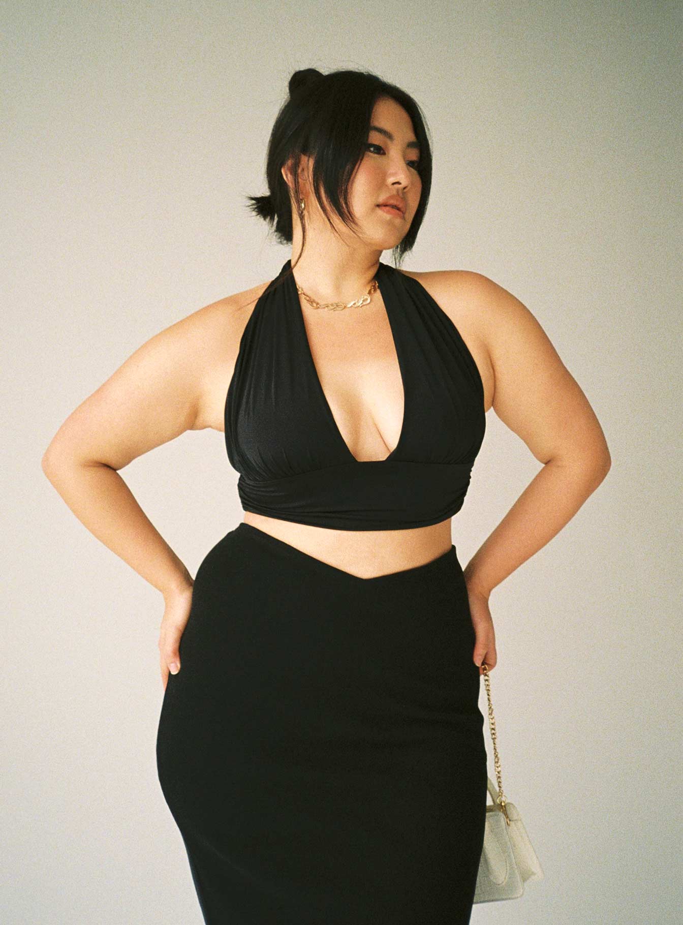 side view of model wearing Princess Polly Jordy Top Black Curve Eco Sleeveless Plunger 