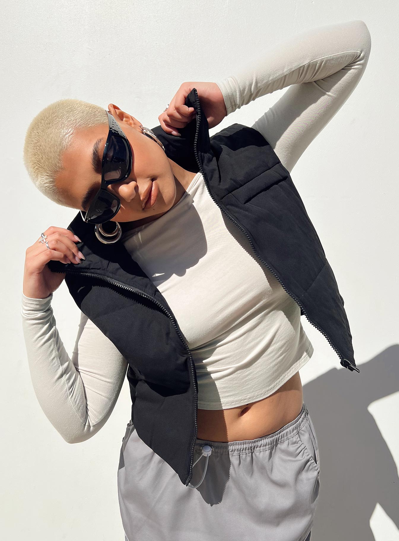 Black puffer vest High neck Zip front fastening  Faux chest pocket 